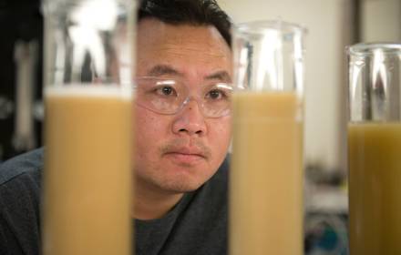 Man working inside a labratory and inspecting different fluids